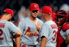 St. Louis Cardinals starting pitcher Dakota Hudson, facing camera, has a talk with pitching coach Mike Maddux (31) during the sixth inning of the team's baseball game against the Kansas City Royals at Kauffman Stadium in Kansas City, Mo., Wednesday, Aug. 14, 2019. (AP Photo/Orlin Wagner)