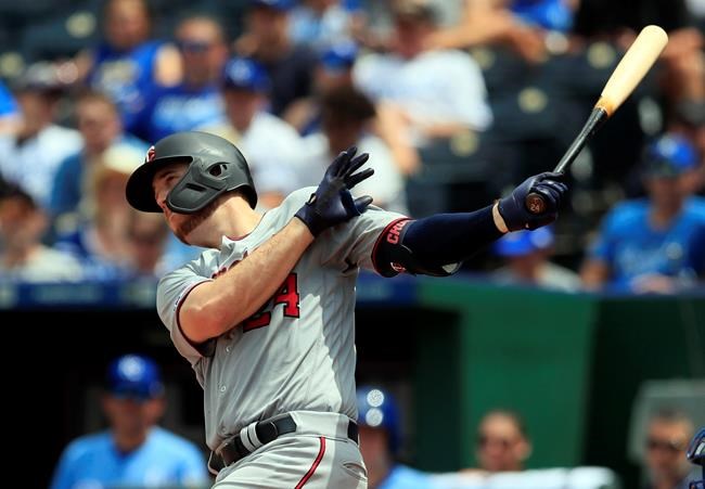 Minnesota Twins' C.J. Cron hits a solo home run off Kansas City Royals starting pitcher Danny Duffy during the eighth inning of a baseball game at Kauffman Stadium in Kansas City, Mo., Saturday, June 22, 2019. (AP Photo/Orlin Wagner)