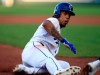 Kansas City Royals' Adalberto Mondesi steals third base during the first inning of a baseball game against the Chicago White Sox at Kauffman Stadium in Kansas City, Mo., Tuesday, July 16, 2019. Mondesi scored on the play. Chicago White Sox third baseman Yoan Moncada was charged with an error. (AP Photo/Orlin Wagner)