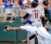 Cleveland Indians' Jose Ramirez (11) beats the throw to Kansas City Royals first baseman Cheslor Cuthbert (19) during the third inning of a baseball game at Kauffman Stadium in Kansas City, Mo., Tuesday, July 2, 2019. Ramirez was safe, but Jason Kipnis was out at second. (AP Photo/Orlin Wagner)