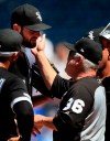Chicago White Sox starting pitcher Lucas Giolito is congratulated and replaced by manager Rick Renteria (36) during the eighth inning of a baseball game against the Kansas City Royals at Kauffman Stadium in Kansas City, Mo., Saturday, June 8, 2019. The White Sox defeated the Royals 2-0. (AP Photo/Orlin Wagner)