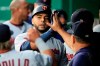 Minnesota Twins designated hitter Nelson Cruz is congratulated by teammates after his solo home run in the eighth inning of a baseball game against the Kansas City Royals at Kauffman Stadium in Kansas City, Mo., Saturday, Sept. 28, 2019. (AP Photo/Orlin Wagner)