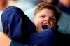Seattle Mariners designated hitter Daniel Vogelbach hugs a teammate while celebrating in the dugout after hitting a solo home run during the 10th inning of a baseball game against the Kansas City Royals at Kauffman Stadium in Kansas City, Mo., Thursday, April 11, 2019. The Mariners defeated the Royals 7-6 in 10 innings. (AP Photo/Orlin Wagner)