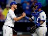 Kansas City Royals relief pitcher Brad Boxberger, left, is congratulated by catcher Martin Maldonado, right, following a baseball game against the Chicago White Sox at Kauffman Stadium in Kansas City, Mo., Thursday, March 28, 2019. The Royals defeated the White Sox 5-3. (AP Photo/Orlin Wagner)