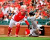 St. Louis Cardinals catcher Andrew Knizner, left, tags out Pittsburgh Pirates' Adam Frazier, right, during the first inning of a baseball game Sunday, Aug. 11, 2019, in St. Louis. (AP Photo/Scott Kane)