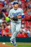 Los Angeles Dodgers starting pitcher Hyun-Jin Ryu pauses at the back of the mound during the second inning of a baseball game against the St. Louis Cardinals, Monday, April 8, 2019, in St. Louis. (AP Photo/Scott Kane)