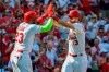 St. Louis Cardinals' Marcell Ozuna, left, celebrates with teammate Matt Carpenter after Carpenter hit a three-run home run during the third inning of a baseball game against the Chicago Cubs Sunday, Sept. 29, 2019, in St. Louis. (AP Photo/Scott Kane)