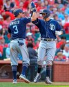 San Diego Padres' Manny Machado, right, celebrates with Ian Kinsler (3) after hitting a two-run home run during the eighth inning of a baseball game against the St. Louis Cardinals, Saturday, April 6, 2019, in St. Louis. (AP Photo/Scott Kane)
