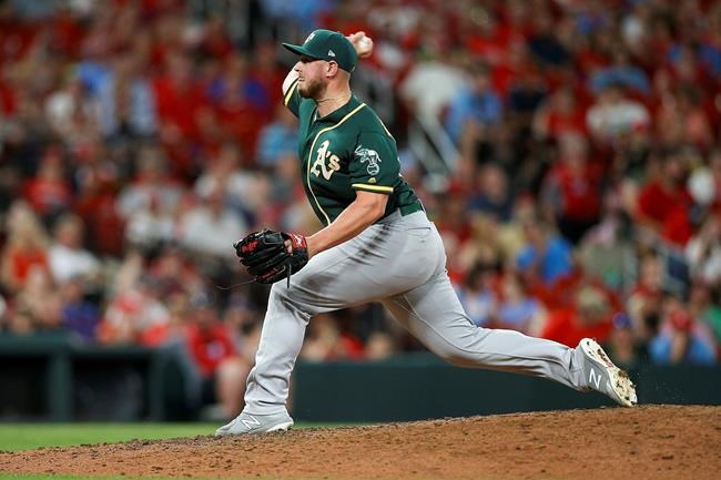 Oakland Athletics relief pitcher J.B. Wendelken throws during the fourth inning of the team's baseball game against the St. Louis Cardinals on Tuesday, June 25, 2019, in St. Louis. (AP Photo/Scott Kane)
