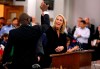 FILE - In this Nov. 28, 2018, file photo, Aldermanic President Lewis Reed, left, high-fives Carolyn Kindle Betz after a proposed soccer stadium in St. Louis was approved by unanimous vote at a meeting in St. Louis. On Tuesday, Aug. 20, 2019, the league officially announced that St. Louis would become its 28th club when it begins play for the 2022 season. “Our ownership group has come a long way since we first announced our bid last October at Mathews-Dickey Boys and Girls Club, and it’s an incredible feeling to now be able to say, ‘St. Louis is home to the first official majority female-led ownership group in MLS,’” said Carolyn Kindle Betz, granddaughter of Enterprise founder Jack Taylor and the president of Enterprise Holdings Foundation. (David Carson/St. Louis Post-Dispatch via AP)