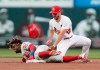 Philadelphia Phillies' Odubel Herrera arrives at second with a double as St. Louis Cardinals shortstop Paul DeJong (12) applies the late tag during the second inning of a baseball game, Tuesday, May 7, 2019, in St. Louis. (AP Photo/Tom Gannam)