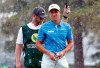 Defending champion Cameron Champ looks around the ninth green as a weather warning is sounded during the opening round of the Sanderson Farms Championship golf tournament in Jackson, Miss., Thursday, Sept. 19, 2019. Play was stopped. (AP Photo/Rogelio V. Solis)