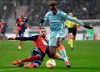 Vidi's Attila Fiola, left, in action against Chelsea's Callum Hudson-Odoi during the UEFA Europa League Group L soccer match between Vidi FC and Chelsea in Groupama Arena in Budapest, Hungary, Thursday, Dec. 13, 2018. (Tibor Illyes/MTI via AP)