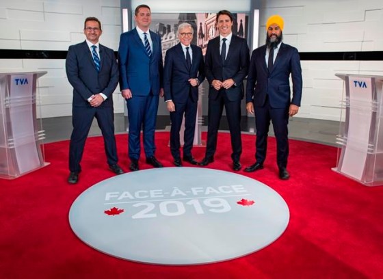Leader of the Bloc Quebecois Yves-Francois Blanchet, left to right, Conservative Leader Andrew Scheer, TVA host Pierre Bruneau, Liberal Leader Justin Trudeau and NDP Leader Jagmeet Singh pose for a photo at the TVA french debate for the 2019 federal election, in Montreal, Wednesday, Oct. 2, 2019. THE CANADIAN PRESS/Joel Lemay, POOL
