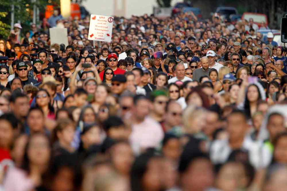 Trevor Hagan / THE CANADIAN PRESS
More than 1,000 people walk in honour of Tina Fontaine and Faron Hall on Alexander Avenue Tuesday night.