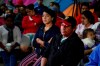 Migrants mainly from Mexico and Central America look on as U.S. President Donald Trump gives a prime-time address about border security on television, Tuesday, Jan. 8, 2019, watching from a border migrant shelter in Tijuana, Mexico. (AP Photo/Gregory Bull)