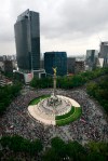 Fans of Mexico's soccer team gather at the Angel of Independence monument to celebrate their team's 2-1 victory over Brazil and winning of the gold medal for men's soccer at the London 2012 Summer Olympics, in Mexico City, Saturday, Aug. 11, 2012. (AP Photo/Marco Ugarte)