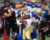 THE CANADIAN PRESS/Justin Tang
Winnipeg Blue Bombers' Chris Randle makes his way past Ottawa Redblacks' to score a touchdown during first half of a CFL football game in Ottawa on Friday, Aug. 4, 2017.