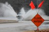 John Woods / The Canadian Press
Overland flooding made for treacherous driving in St. Adolphe.
