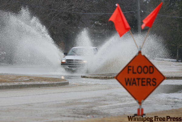 John Woods / The Canadian Press
Overland flooding made for treacherous driving in St. Adolphe.