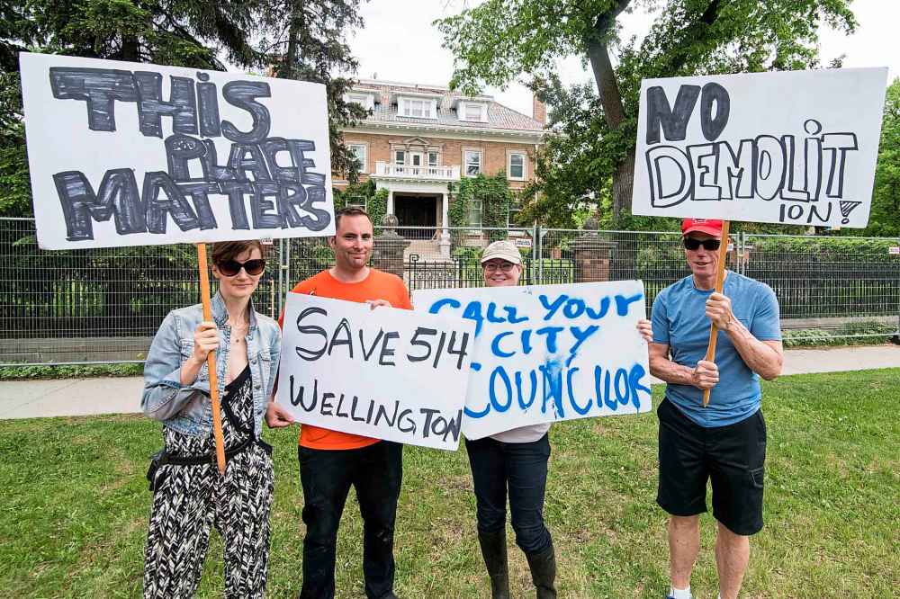 Kelly Boileau (from left), Ben Shedden, Jane Goodridge and Nick Logan were outside the mansion Saturday afternoon to ensure the last-minute stop work order was respected. (Mike Sudoma / Free Press files)