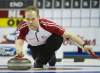 Nathan Denette / The Canadian Press
Newfoundland/Labrador third Mark Nichols throws a rock while playing against Ontario during the Brier Canadian Curling Championships in London, Ont.
