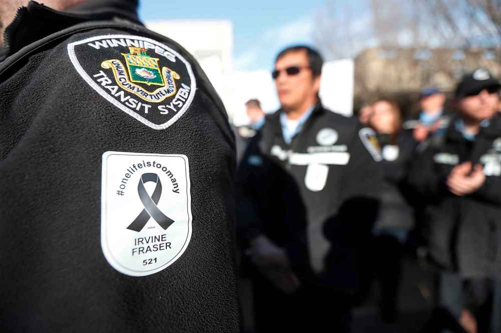 John Woods / The Canadian Press files
Winnipeg bus drivers gathered to support each other at a rally for Irvine Fraser, who was killed by a passenger, and to demand safety improvements on buses outside city hall in Winnipeg in February 2017.