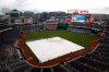 A tarp covers the infield during a rain delay before a baseball game between the Philadelphia Phillies and the Washington Nationals, Monday, June 17, 2019, in Washington. (AP Photo/Patrick Semansky)