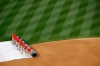 Grounds crew members roll a tarp over the infield during a rain delay before a baseball game between the Philadelphia Phillies and the Washington Nationals, Tuesday, June 18, 2019, in Washington. (AP Photo/Patrick Semansky)