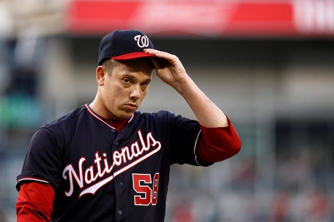 Washington Nationals starting pitcher Jeremy Hellickson walks off the field in the middle of the first inning of the team's baseball game against the New York Mets, Tuesday, May 14, 2019, in Washington. Hellickson gave up a grand slam in the inning. (AP Photo/Patrick Semansky)