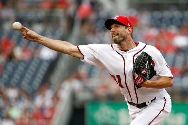 Washington Nationals starting pitcher Max Scherzer throws to the Colorado Rockies in the third inning of a baseball game, Thursday, July 25, 2019, in Washington. (AP Photo/Patrick Semansky)