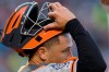 San Francisco Giants catcher Buster Posey wears a No. 42 patch on his sleeve in honor of Jackie Robinson Day, during the first inning of the team's baseball game against the Washington Nationals, Tuesday, April 16, 2019, in Washington. (AP Photo/Nick Wass)