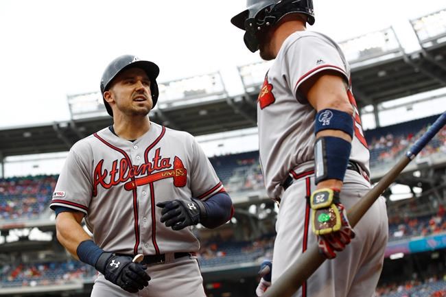 Atlanta Braves' Adam Duvall, left, celebrates his solo home run with teammate Tyler Flowers in the second inning of a baseball game against the Washington Nationals, Wednesday, July 31, 2019, in Washington. (AP Photo/Patrick Semansky)