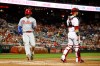 Philadelphia Phillies' Bryce Harper, left, scores past Washington Nationals catcher Yan Gomes on Rhys Hoskins' single during the fourth inning of a baseball game, Wednesday, Sept. 25, 2019, in Washington. (AP Photo/Patrick Semansky)