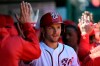 Washington Nationals' Trea Turner celebrates his three-run home run in the dugout during the third inning of a baseball game against the New York Mets, Sunday, March 31, 2019, in Washington. (AP Photo/Nick Wass)