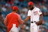 Washington Nationals relief pitcher Wander Suero, right, is pulled by manager Dave Martinez, left, during the tenth inning of a baseball game against the San Diego Padres, Saturday, April 27, 2019, in Washington. (AP Photo/Nick Wass)