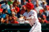 Washington Nationals' Anthony Rendon hits a sacrifice fly ball in the sixth inning of the first baseball game of a doubleheader against the Philadelphia Phillies, Tuesday, Sept. 24, 2019, in Washington. Trea Turner scored on the play. (AP Photo/Patrick Semansky)
