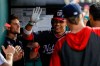 Washington Nationals' Juan Soto celebrates his solo home run with his teammates during the fourth inning of their baseball game against the Cincinnati Reds at Nationals Park, Tuesday, Aug. 13, 2019, in Washington. (AP Photo/Alex Brandon)