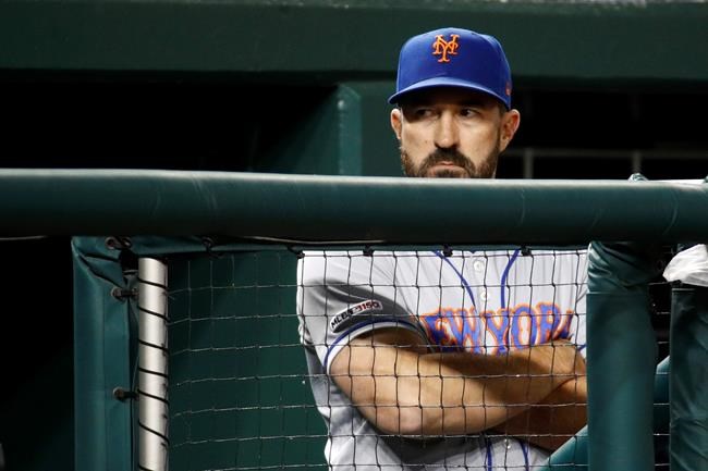New York Mets manager Mickey Callaway stands in the dugout in the eighth inning of a baseball game against the Washington Nationals, Wednesday, May 15, 2019, in Washington. (AP Photo/Patrick Semansky)