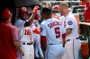 Washington Nationals' Victor Robles, left, celebrates his home run with Adrian Sanchez, center, and Matt Adams, right, in the dugout during the seventh inning of a baseball game against the Kansas City Royals, Sunday, July 7, 2019, in Washington. The Nationals won 5-2. (AP Photo/Nick Wass)