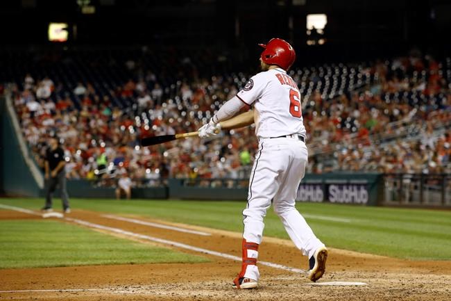Washington Nationals' Anthony Rendon watches his grand slam in the sixth inning of a baseball game against the Atlanta Braves, Monday, July 29, 2019, in Washington. (AP Photo/Patrick Semansky)