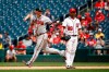 Atlanta Braves' Josh Donaldson, left, rounds the bases past Washington Nationals first baseman Gerardo Parra after hitting a solo home run in the 10th inning of a baseball game, Wednesday, July 31, 2019, in Washington. Atlanta won 5-4 in 10 innings. (AP Photo/Patrick Semansky)