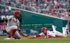 Philadelphia Phillies third baseman Maikel Franco waits to tag Washington Nationals' Juan Soto, who tried to steal third base during the first inning of a baseball game in Washington, Thursday, June 20, 2019. Soto was tagged out. (AP Photo/Manuel Balce Ceneta)