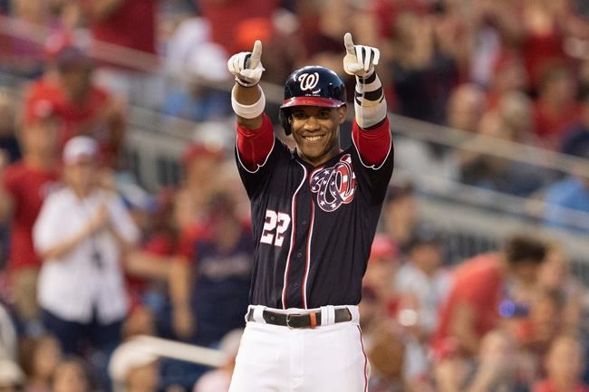 Washington Nationals Juan Soto (22) gestures after hitting a triple during the fifth inning of a baseball game against the Atlanta Braves in Washington, Friday, June 21, 2019. (AP Photo/Manuel Balce Ceneta)