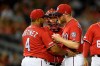 Washington Nationals relief pitcher Sean Doolittle, right, is pulled from the baseball game by manager Dave Martinez (4) during the ninth inning against the Milwaukee Brewers, Saturday, Aug. 17, 2019, in Washington. Catcher Kurt Suzuki is at rear. (AP Photo/Nick Wass)