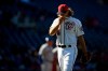 Washington Nationals relief pitcher Trevor Rosenthal walks toward the dugout after he was pulled during the eighth inning of a baseball game against the New York Mets, Sunday, March 31, 2019, in Washington. (AP Photo/Nick Wass)