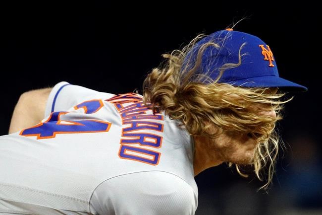 New York Mets starter Noah Syndergaard follows through on a pitch to the Washington Nationals in the eighth inning of a baseball game Tuesday, May 14, 2019, in Washington. (AP Photo/Patrick Semansky)