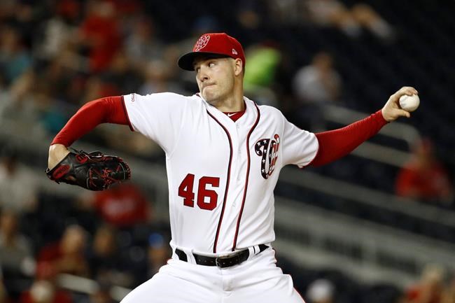 Washington Nationals starting pitcher Patrick Corbin throws to the Colorado Rockies in the first inning of the second baseball game of a doubleheader, Wednesday, July 24, 2019, in Washington. (AP Photo/Patrick Semansky)