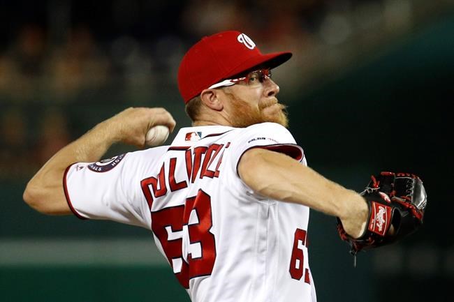 Washington Nationals relief pitcher Sean Doolittle throws to the Atlanta Braves in the ninth inning of a baseball game, Monday, July 29, 2019, in Washington. (AP Photo/Patrick Semansky)