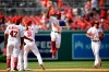 Washington Nationals' Victor Robles (16) celebrates with Brian Dozier (9), Howie Kendrick (47), Juan Soto (22) and others after a baseball game against the Los Angeles Dodgers, Sunday, July 28, 2019, in Washington. The Nationals won 11-4. (AP Photo/Nick Wass)
